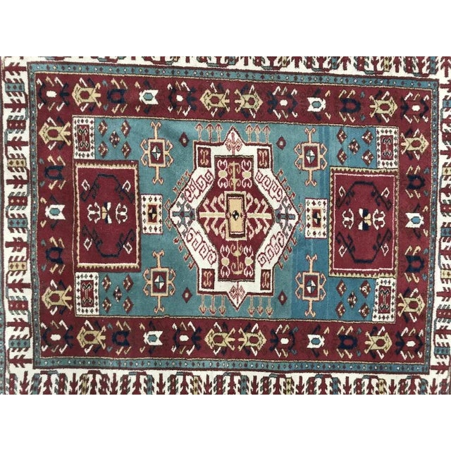 Beautiful late 20th century fine Turkish rug from Konya with a geometrical Kazak design and nice colors, with purple,...