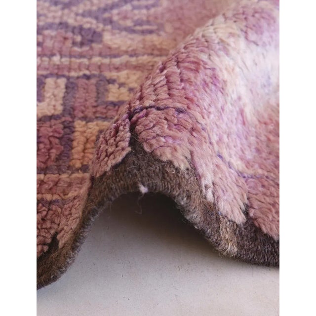 Add bold character and cultural depth to your space with this rare vintage Moroccan Ait Bou Sbaa rug. Handwoven from soft...