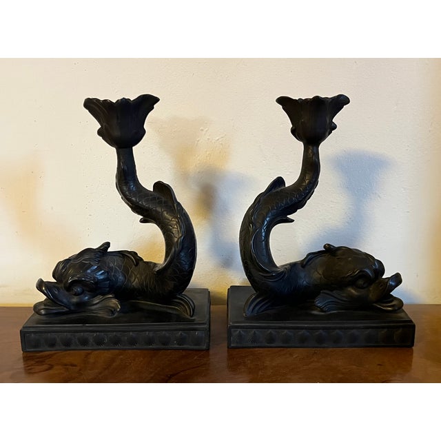 Pair antique 19th century English Regency Wedgwood black basalt dolphin form candlestick holders. Mounted atop a stepped...