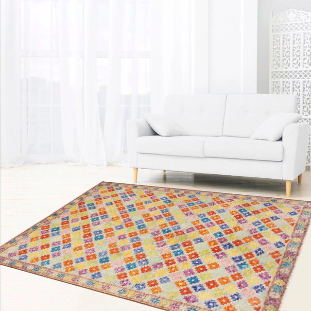 A mesmerizing addition to any decor, this exhilarating hand-knotted rug featuring exquisite coloration in an intricate...