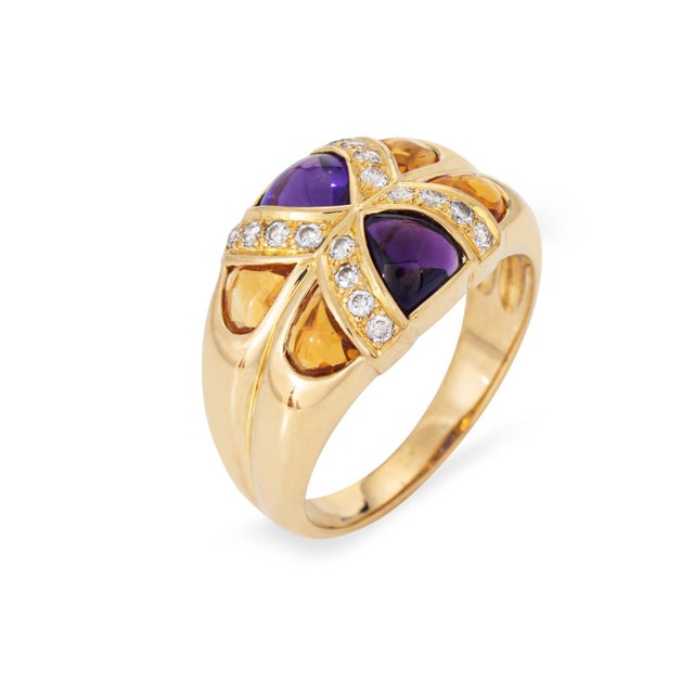 Stylish contemporary amethyst, citrine & diamond ring crafted in 19k yellow gold (circa 1980s). Cabochon cut amethyst...