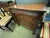 Early 19th century Empire style small chest of drawers. Three drawers with pulls, rolled top drawer. Column and paw feet...
