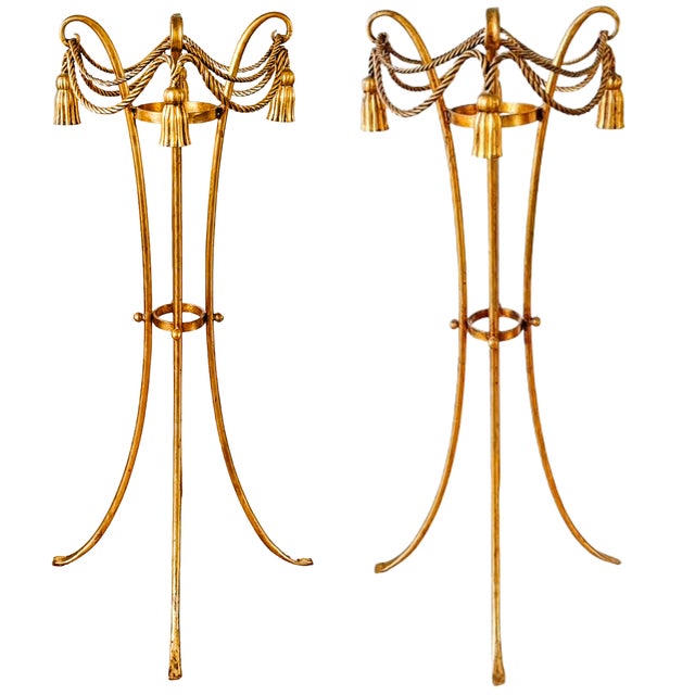 A striking pair of vintage Italian Hollywood Regency plant stands, hand-forged in gilt metal. They feature a tripod base...