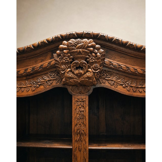 A stunning example of late 19th-century French craftsmanship, this Louis XV Revival armoire showcases richly hand-carved...