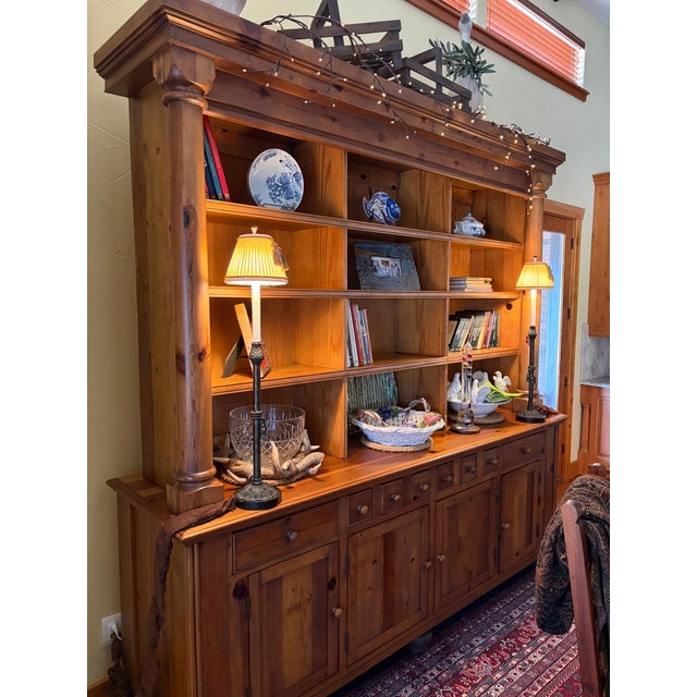 Impressive Ralph Lauren Home solid pine bookcase and display hutch in a classic English Country style. This substantial...