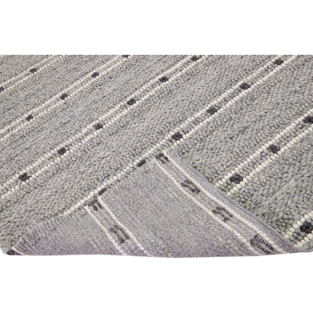 Beautiful Contemporary Thom Filicia Home Collection Rugs. This Indian hand-woven rug is made of wool & viscose and has a...