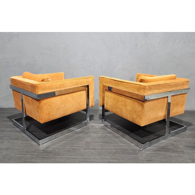 Experience the timeless elegance of mid-century modern design with our Milo Baughman Large T-Back Lounge Chairs in Orange...