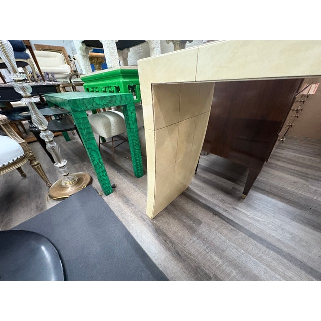 Italian Modern Parchment Console Table. Offered is a shapely Italian mid century modern parchment console table with a...