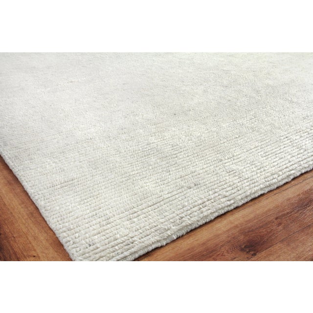 The subtle variations in color of the Hamilton rug give enough interest in design while still reading as a neutral. Hand-...