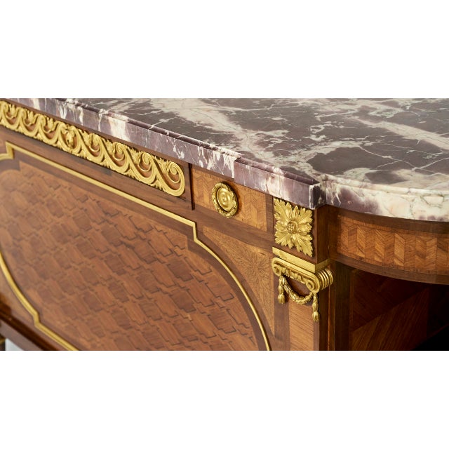An exquisite and spectacular credenza, a Louis XVI style piece of furniture, made around 1830 by Maison Krieger, after the...
