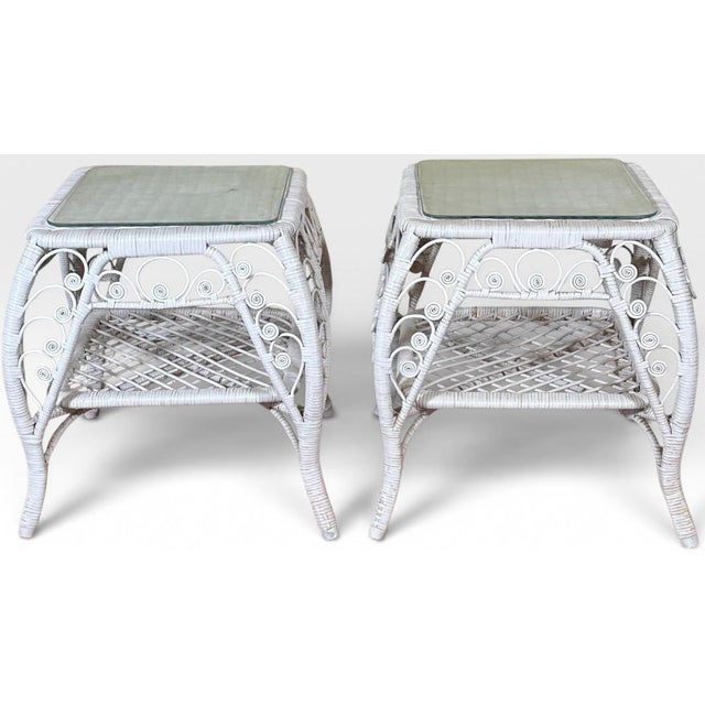 Vintage Boho Chic White Wicker Scrolled Side Tables With Glass Tops - A Pair Introduce an airy touch of vintage romance...