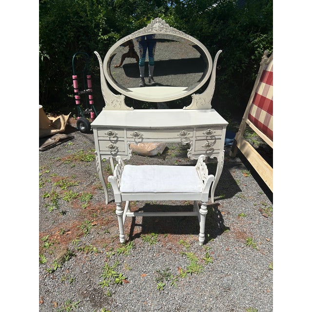 Lovely white painted vintage French style vanity having cabriole legs, 5 drawers for storage, and a pretty large oval...