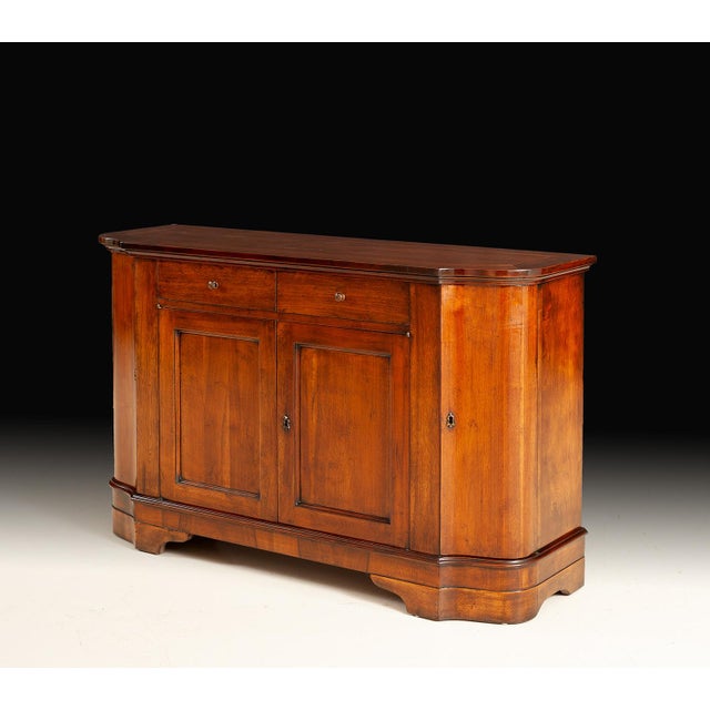 Handcrafted in Italy from solid walnut, this classic sideboard embodies understated European elegance. The warm, hand-...