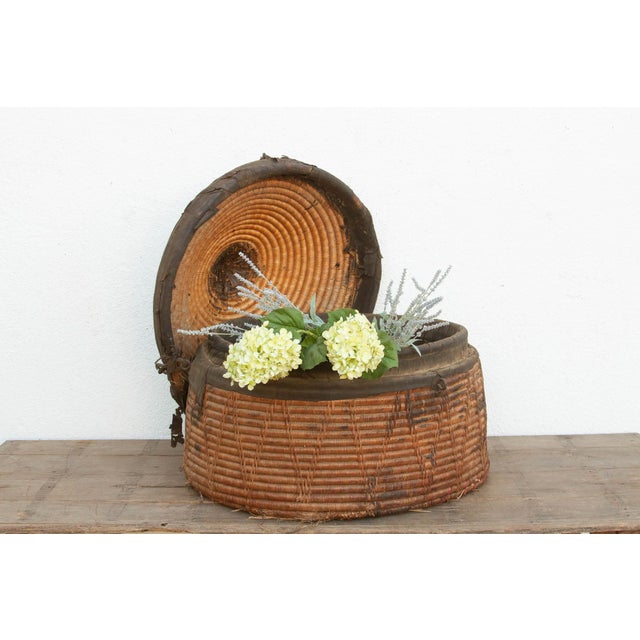 At nearly three feet wide, this monumental lidded grain basket is a remarkable artifact of nomadic history. Crafted to...