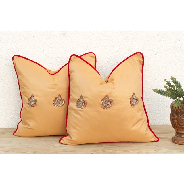 Crafted in India from a lustrous silk-blend textile, this pillow cover is embellished by hand with traditional Zardozi-...