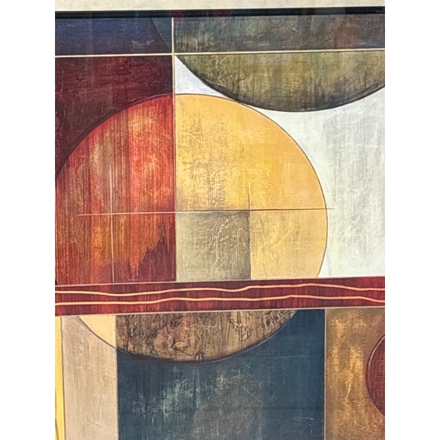 A signed and framed print of a striking mid century modern painting with vibrant colors and geometric design. The artist's...