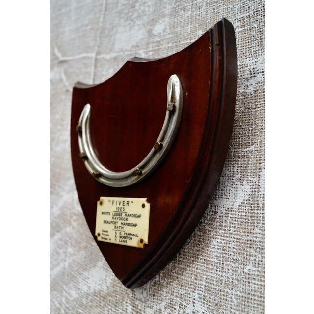 A Superb winner's horseshoe plaque belonging to the winning horse ‘Fiver’. Dated 1925. The horseshoe is mounted on an oak...