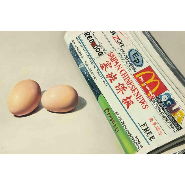 Eggs and newspaper is an original oil painting realized by Zhang Wei Guang (Mirror) in 2006. Includes frame. Hand signed...