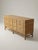 Stunning vintage dresser is crafted from pencil rattan with a smooth wood top. This piece has twelve drawers arranged in...