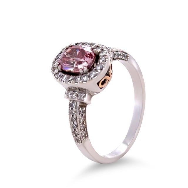 This exquisite pink-coloured diamond ring is crafted in 18ct white gold with rose gold highlights and hand-made to the...