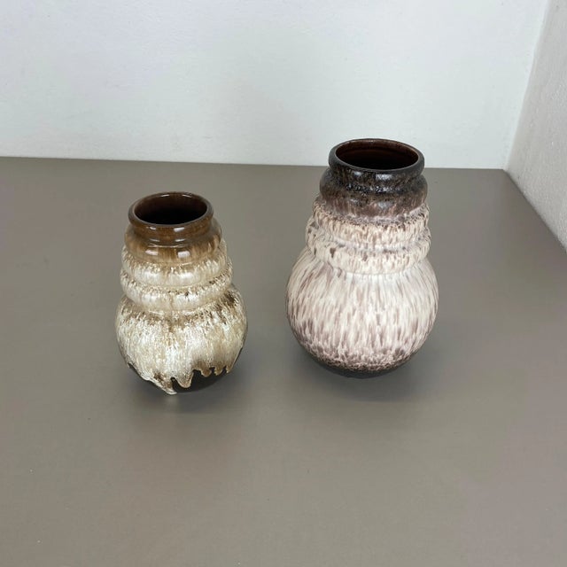 Set of two fat lava art vases Producer: Scheurich, Germany Decade: 1970s These original vintage vases was produced in the...