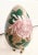A beautiful floral large Cloisonne egg on a brass stand. The egg features beautiful colors with a large pink, green, red...