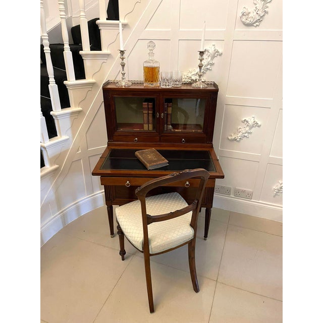 Quality antique french mahogany fold down desk having the original pretty brass gallery, two glazed doors, two drawers...