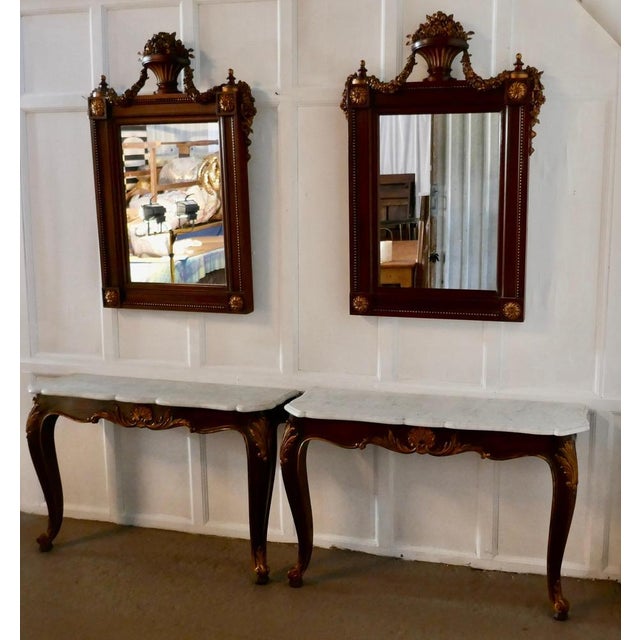 Pair of French marble-top console tables with mirrors This is a very attractive pair, the tables are 19th century and...