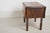 Antique French Pembroke drop leaf table featuring beautifully figured walnut veneer, two drawers, a pull-out shelf door,...