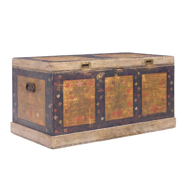 A striking 19th century Continental dowry chest, likely Eastern European, featuring a richly layered painted surface with...