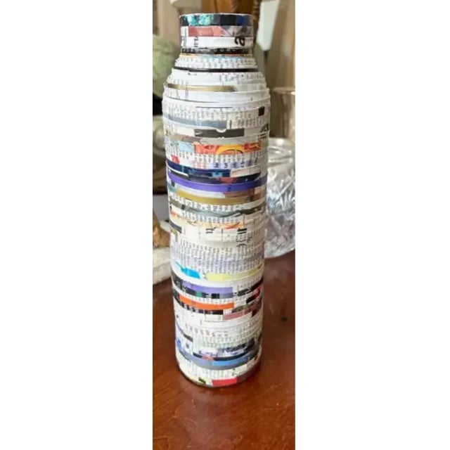 A fun interesting decortive object. The vase is made of paper and is called paper mache" Put faux flowers or branches in...