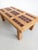 Brutalist rectangular coffee table with tiled top and wooden base from 1970s France.