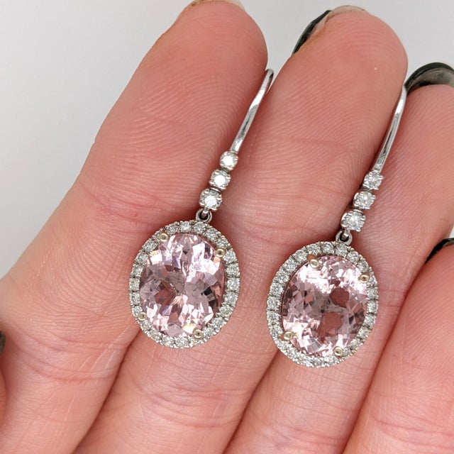 Turn heads with these warm peachy-pink Morganite drop earrings, set in solid 14K White Gold. Each earring centers a hand-...