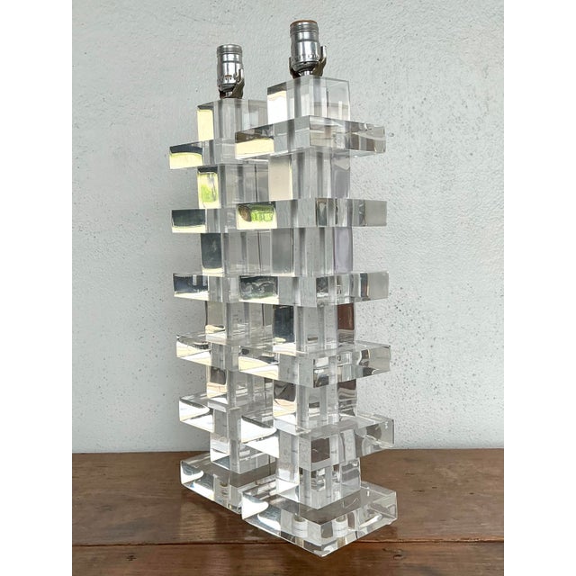 This exceptional pair of vintage table lamps is a masterclass in Postmodern geometry and architectural light. Crafted from...