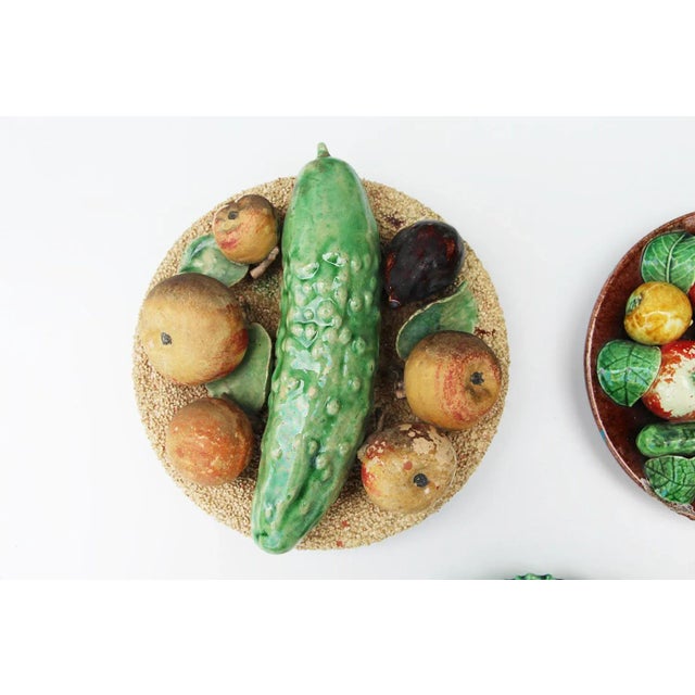 All early 20th Century artists. dimensions: Plate with the cucumber, apples and one fig - ANTÓNIO ALVES CUNHA CALDAS DA...