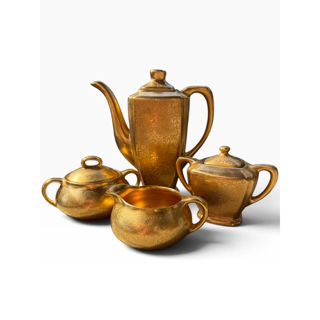 Exquisite vintage four-piece tea and coffee service by Wheeling Decorating Co., featuring the highly decorative “Doves,...