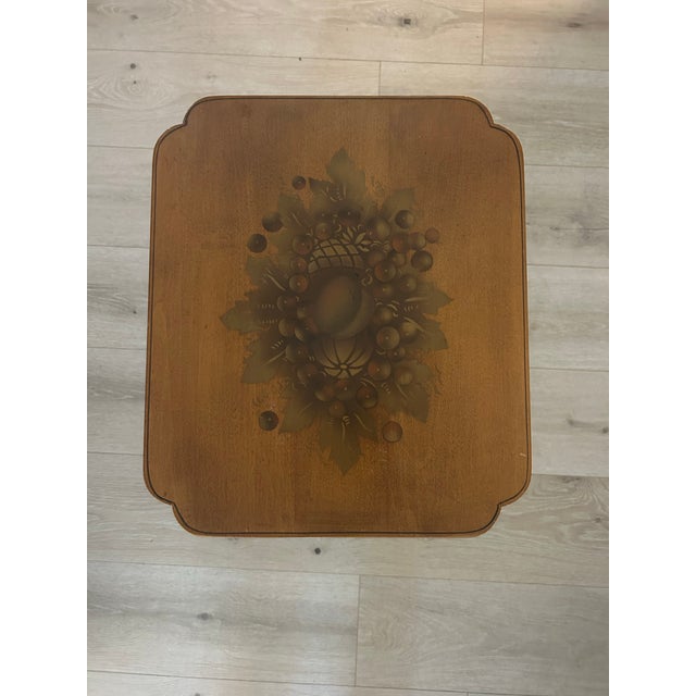 Vintage candlestick side table created and designed by Hitchcock. Makers mark on table underside (shown in photos). Top is...