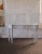 Vintage French Country style custom artisan made console table from a New England estate. Circa 1981. More recently...