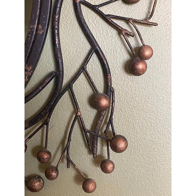 This stunning wall mirror from the 1970s features a beautiful faux bois design with branches and copper painted berries,...