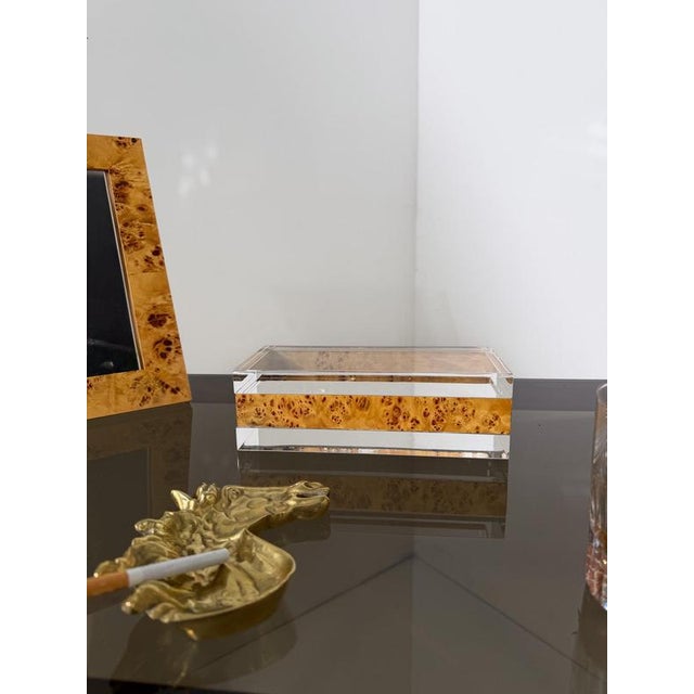 Highly decorative vintage box, made in Italy around the 1970s in clear Lucite with a beautiful burl wood insert. The box...
