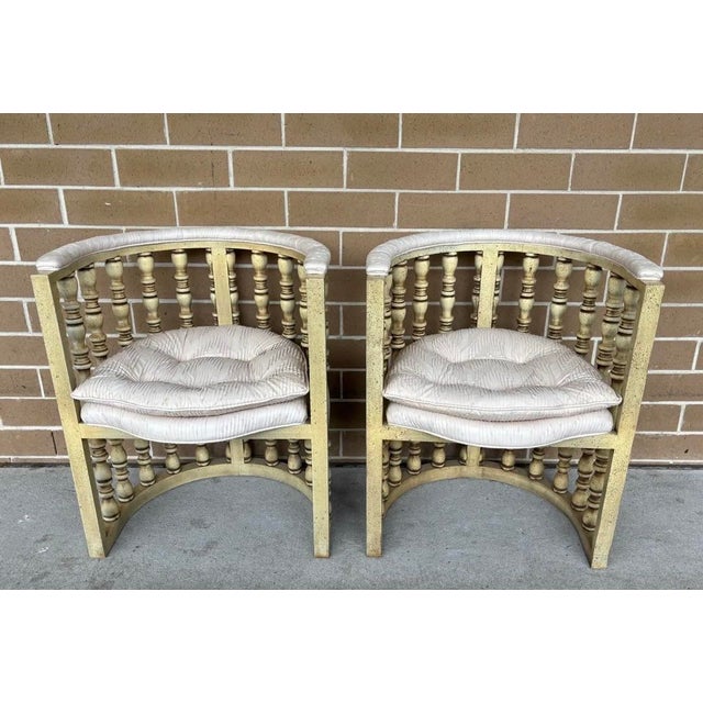 A truly sensational pair of Hollywood regency spindle back barrel chairs in beautiful condition. These have a bit of a...