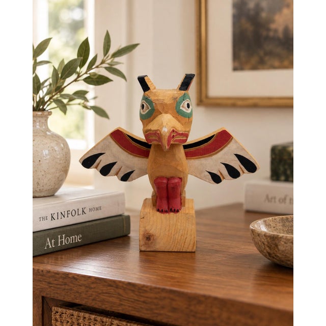 Vintage hand-carved and hand-painted wooden bird totem sculpture from Alaska Black Diamond, accompanied by its original...