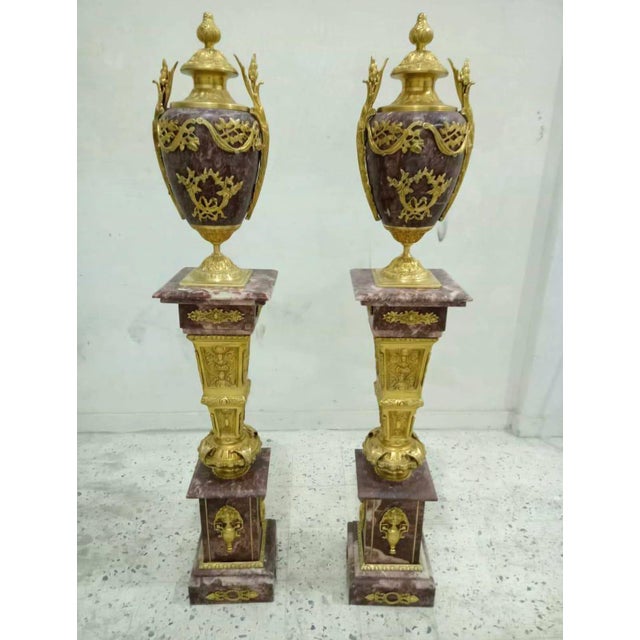 Make a striking statement with this exquisite French-style porcelain vase on pedestal, featuring a rich burgundy finish...