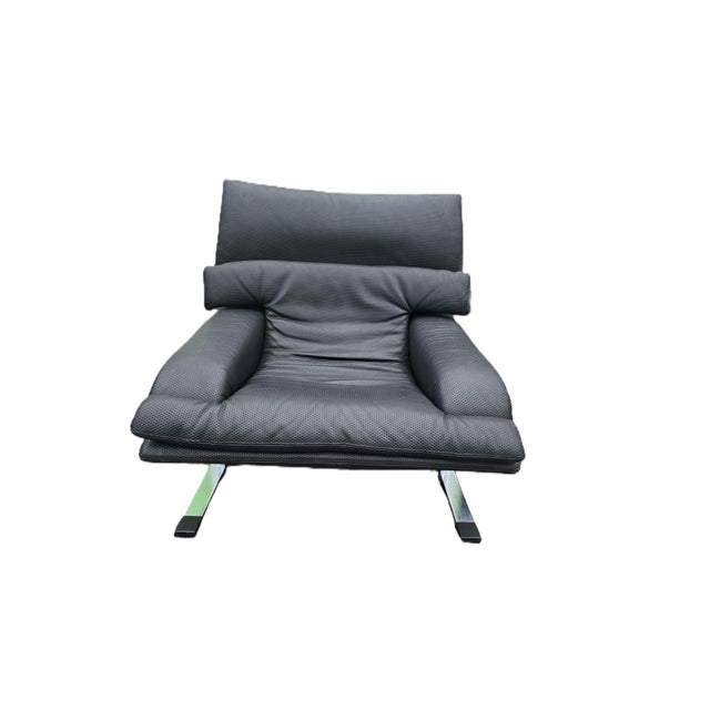 Elevate your space with this striking "Onda" lounge chair designed by Giovanni Offredi for Saporiti Italia during the...