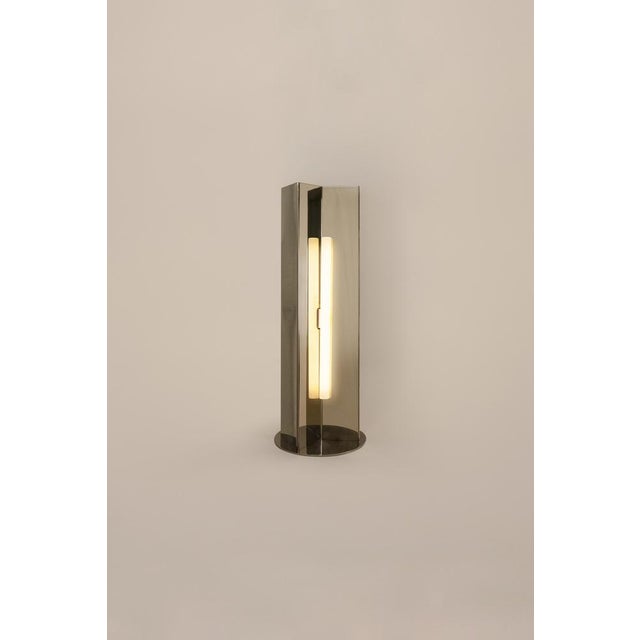 Arrow stainless steel table lamp without diffuser by violaine d'harcourt dimensions: d 8,8 x w 14 x h 40 cm. Materials:...
