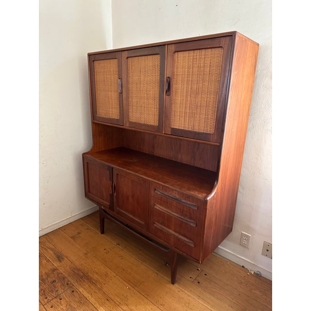 H: 62.6” W: 49.6” D: 18” A British midcentury teak storage cabinet from G Plan’s Fresco range, combining substantial...