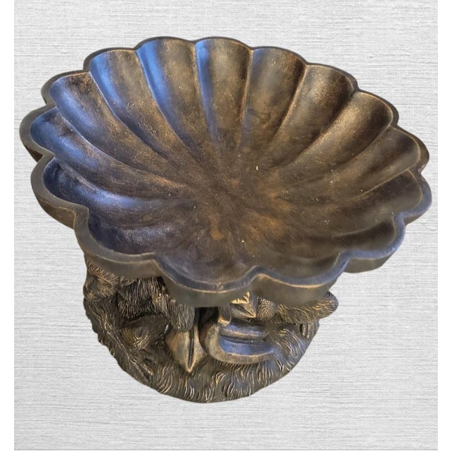 A very large scalloped carved monkey and fruit decorative fruit catchall table top bowl. The bowl features a brown/bronze,...