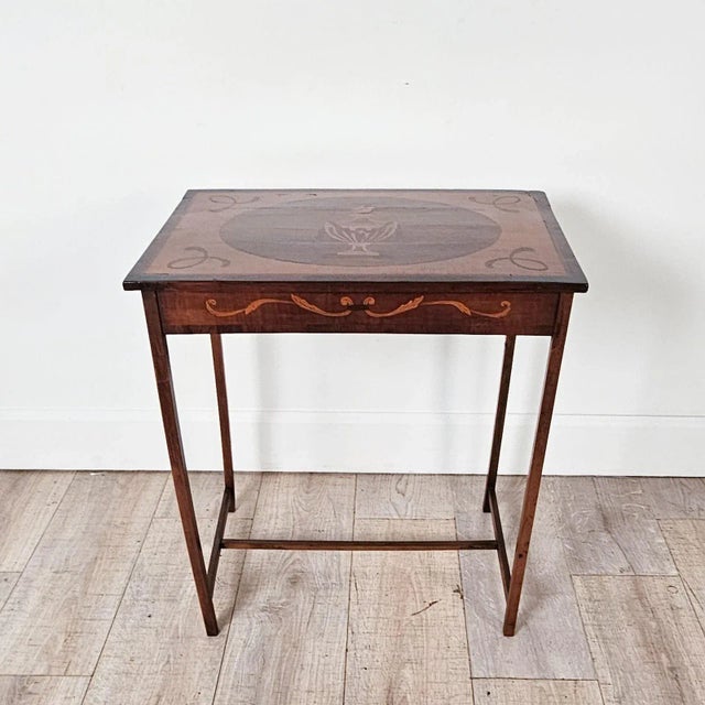 A Neoclassical Dutch side table inlaid with mixed woods, circa 1840.