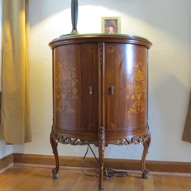 Neither museum quality nor abused. Some light wear and tear on the top edge. Top protected by glass. Marquetry is clean....