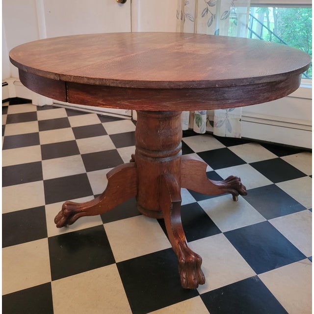 A rich, solid oak century old or more table with a lot of history and character. Refinish it if you must, but it is...